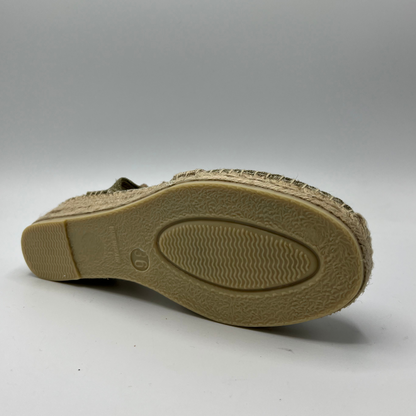 Bottom view of a canvas and textile espadrille with a low platform sole. 