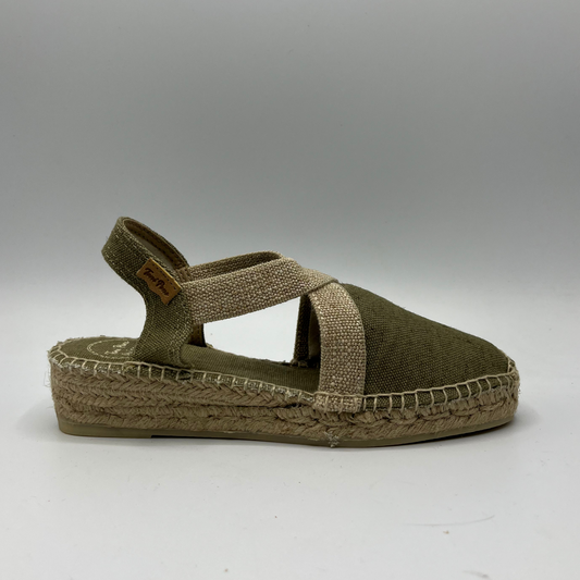 Right facing view of a canvas and textile espadrille with a low platform sole. 