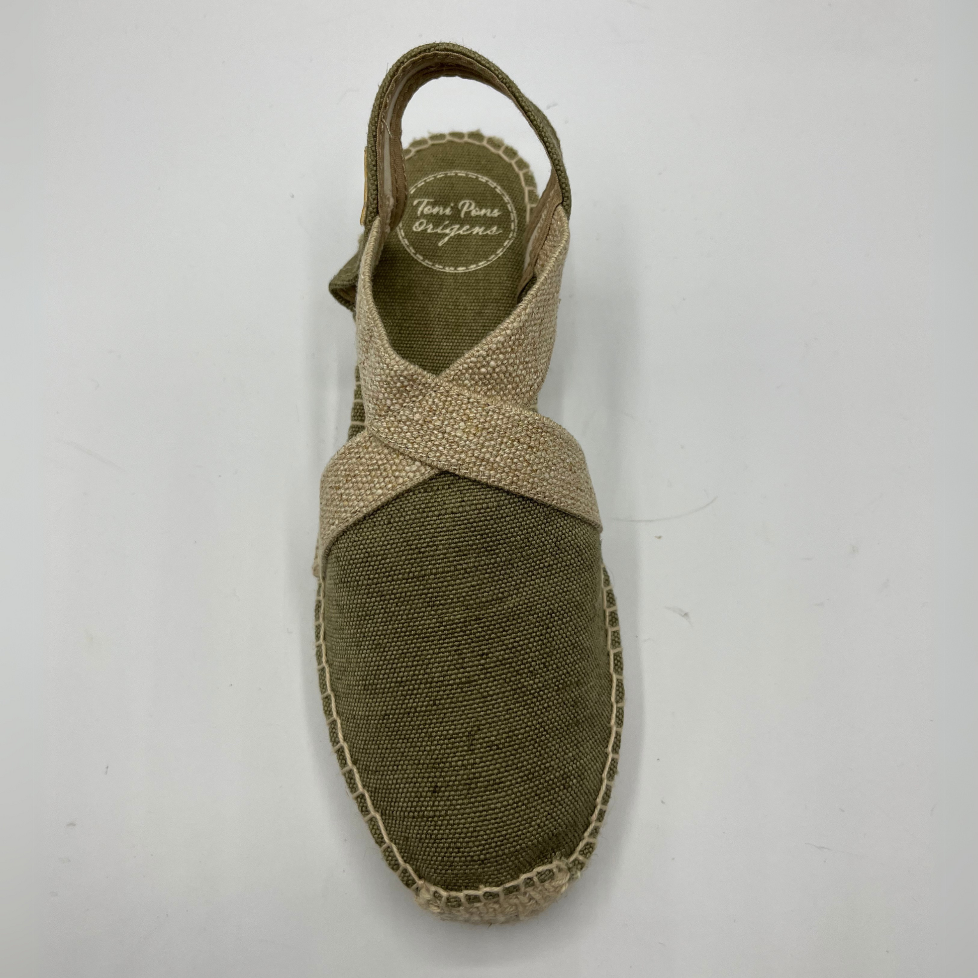 Top view of a canvas and textile espadrille with a low platform sole. 