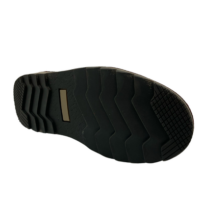 Bottom view of short boot with black sole and grooved tread