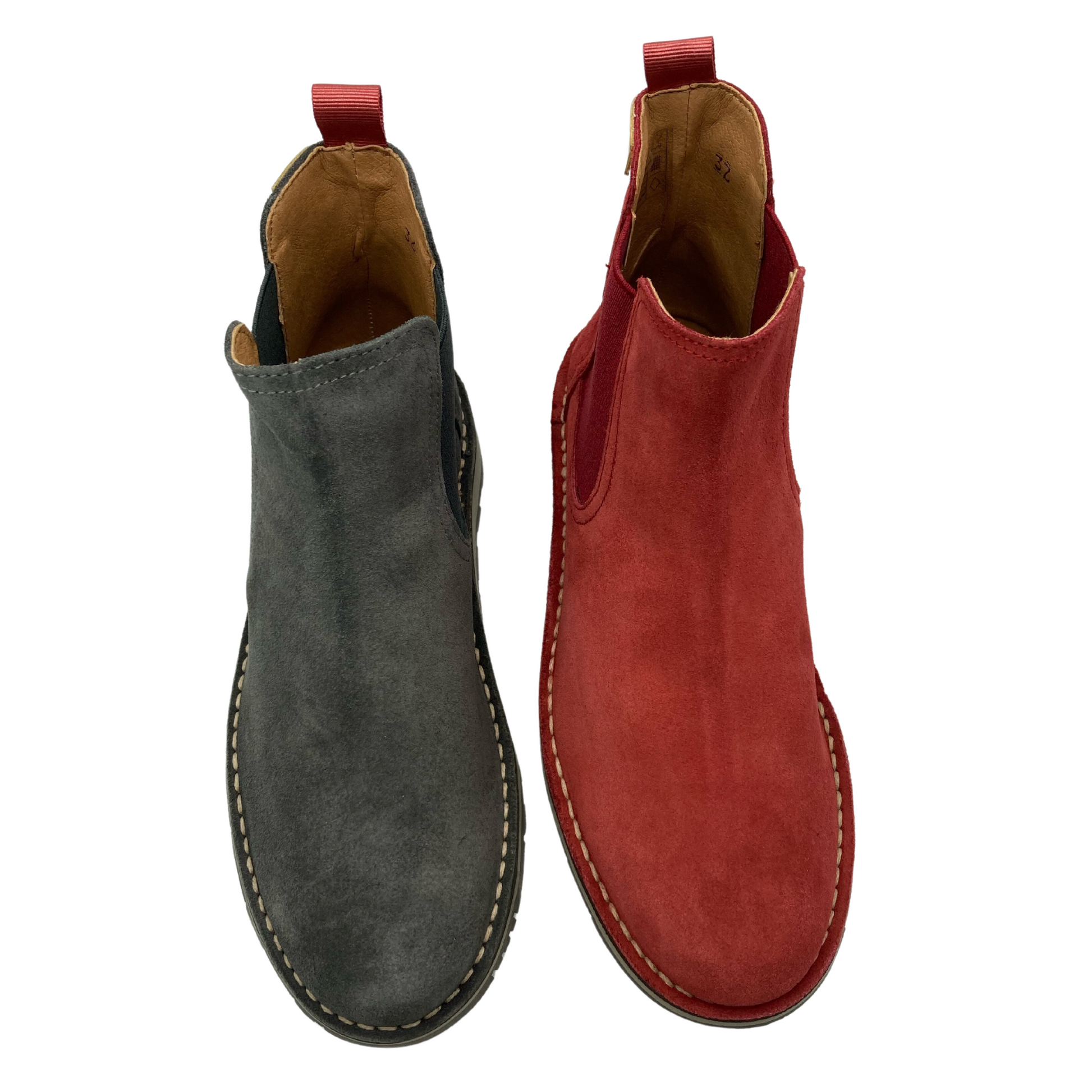 View of one grey boot and one red boot side by side. Both are leather with a rounded toe and red pull on tab.