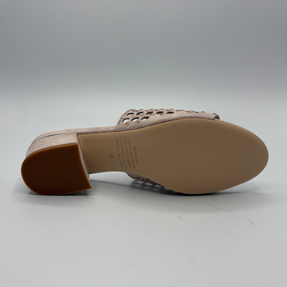 Beige sandal with cut-out design on a light gray background