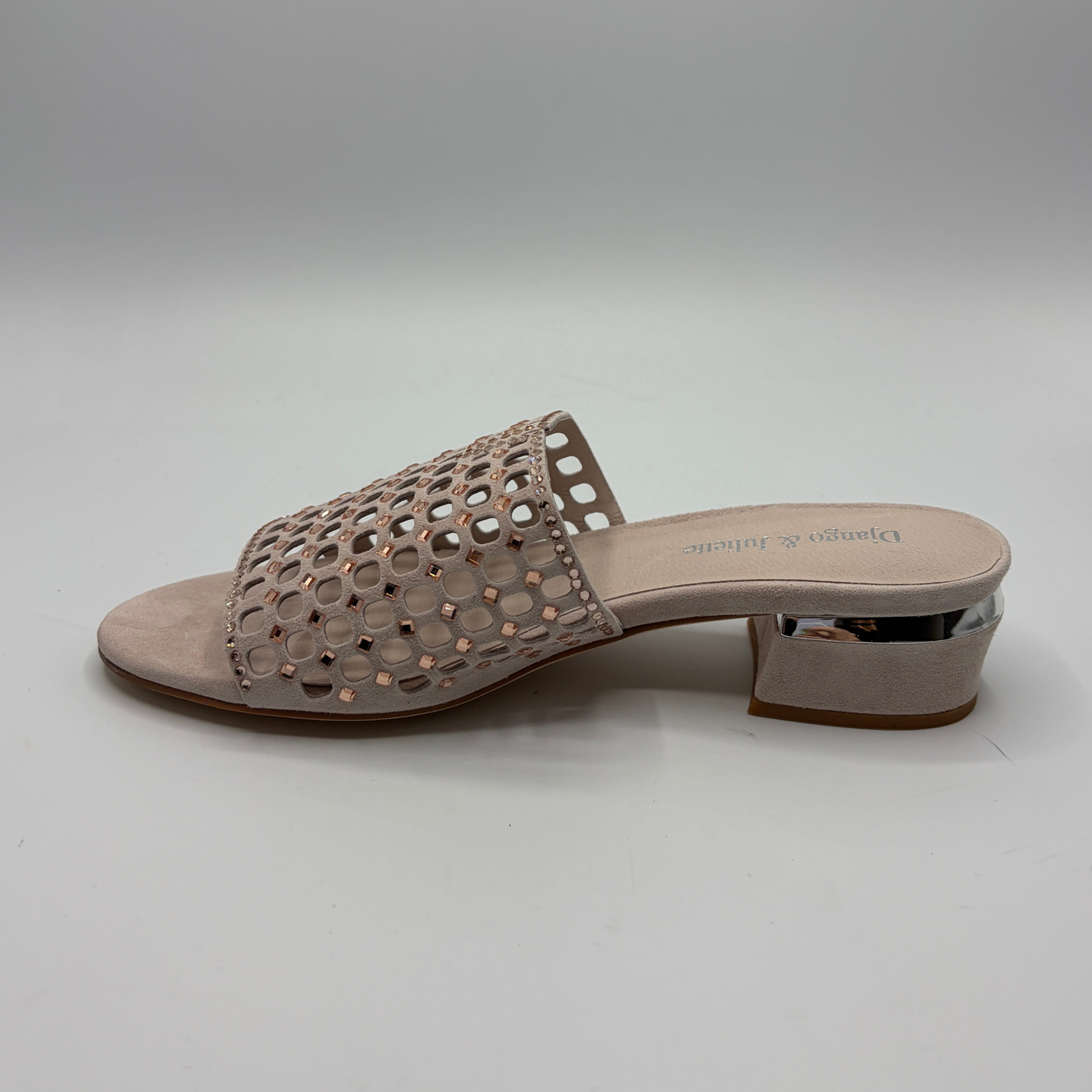 Beige sandal with cut-out design on a light gray background