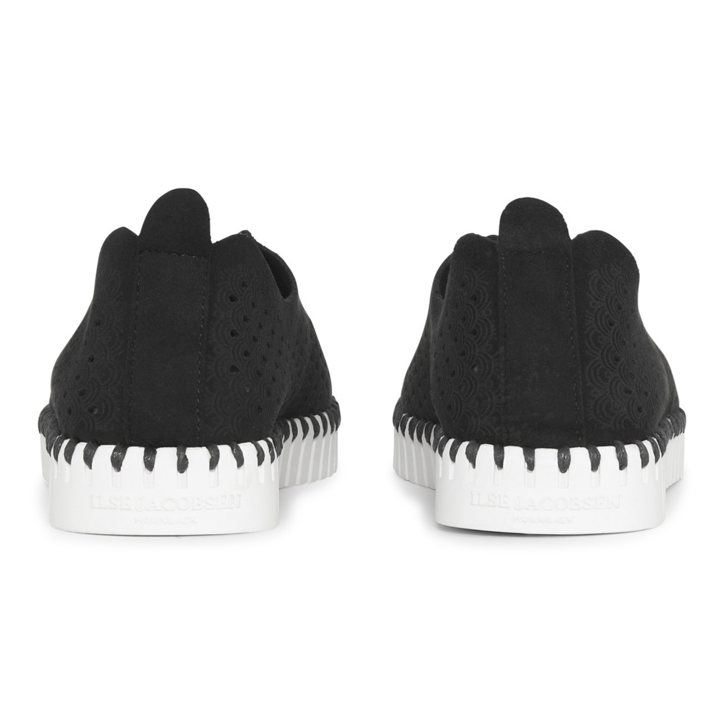 Black slip-on shoes with white soles on a white background