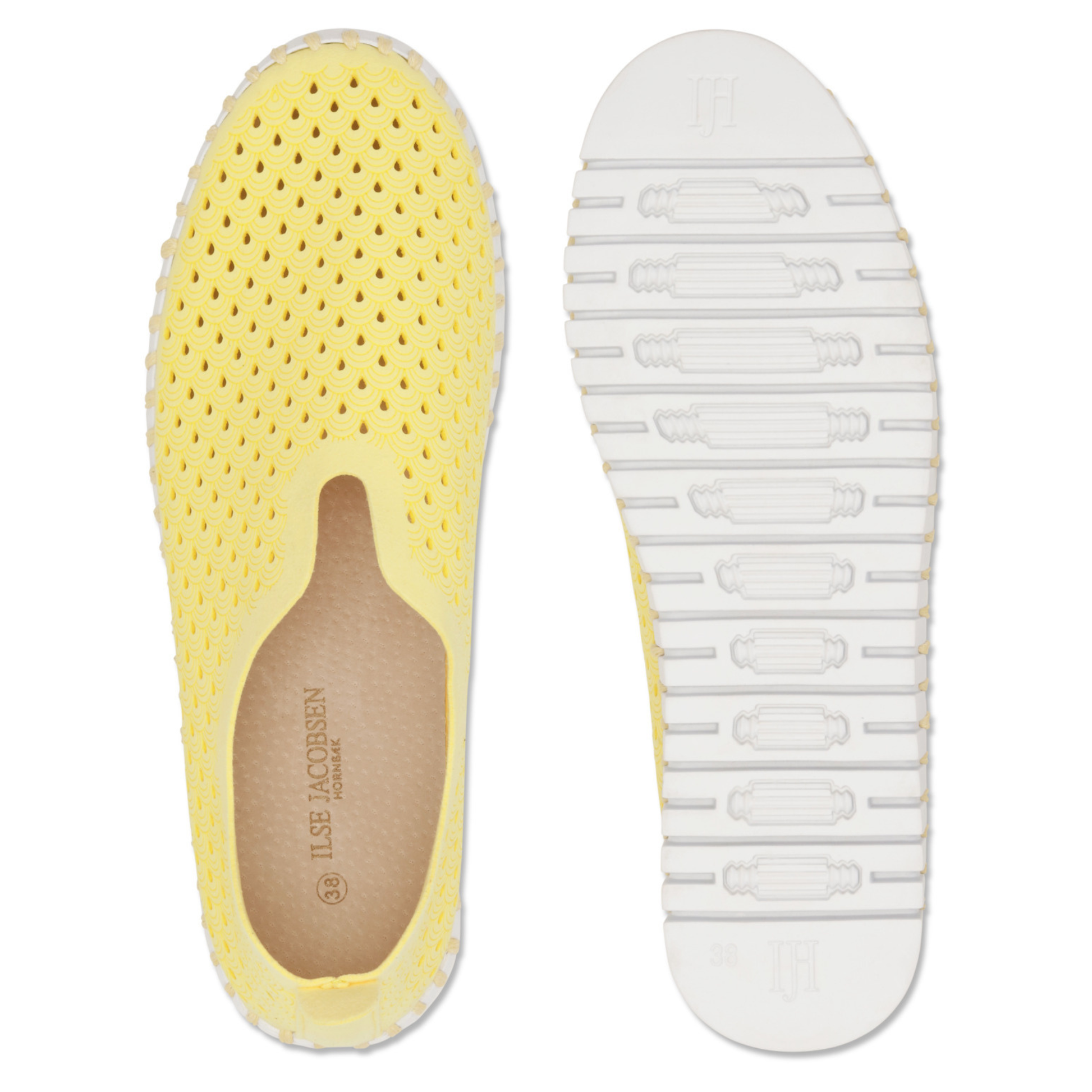 View of a pair of yellow slip on shoes with a white outsole