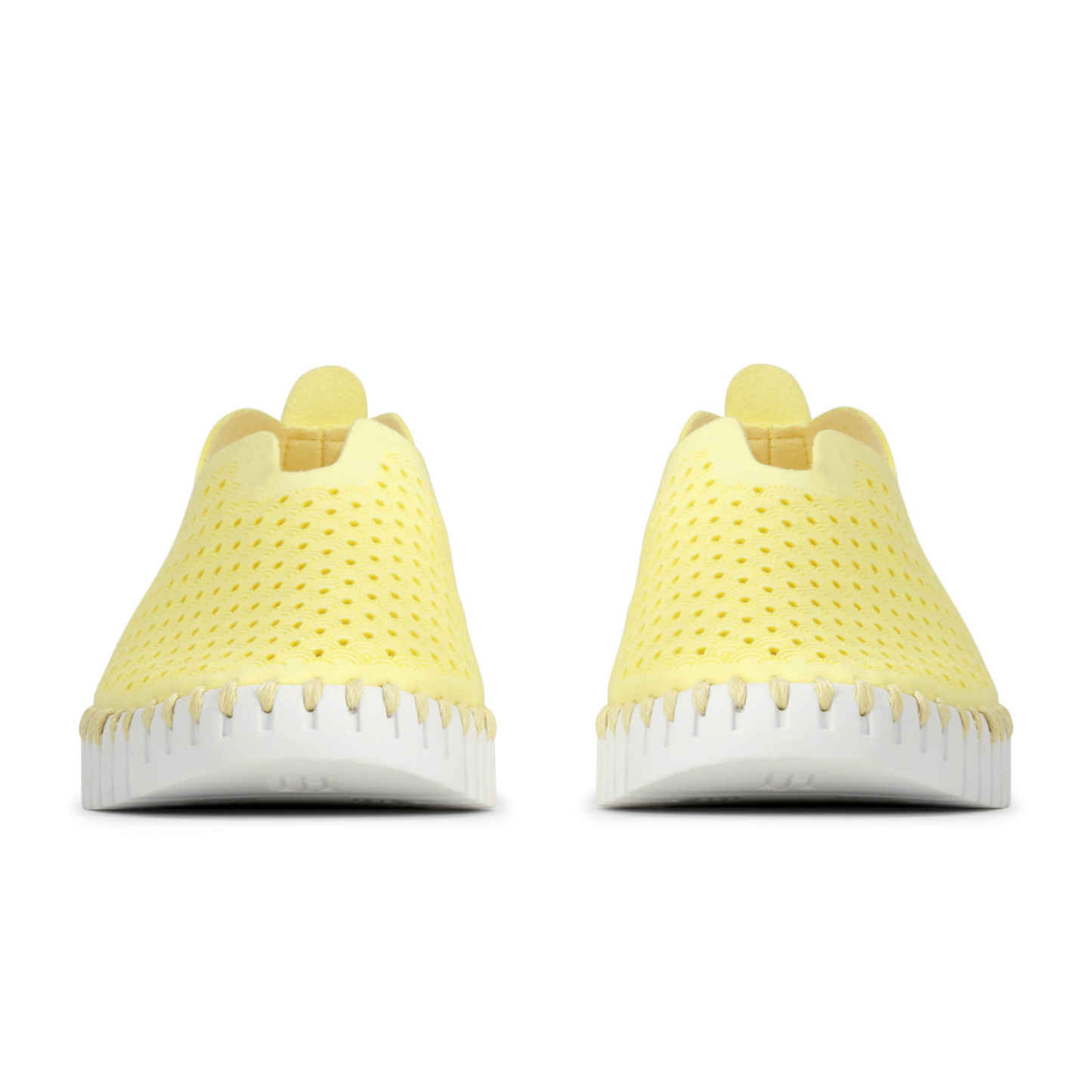Yellow sneakers with white soles on a white background