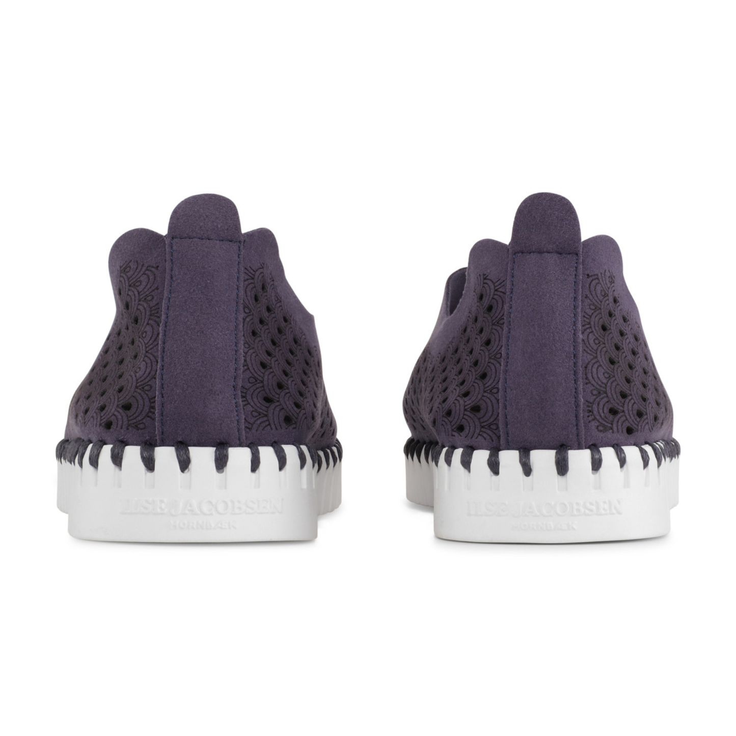 Navy sneakers with white soles on a white background