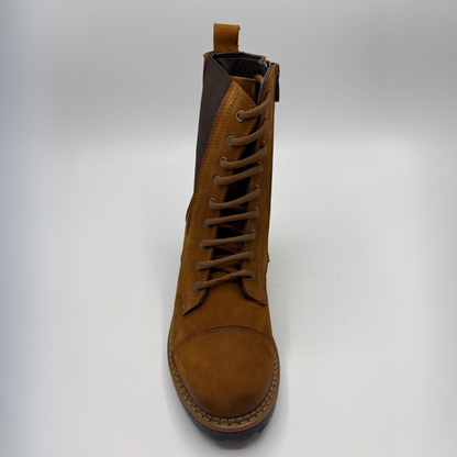 Front view of a tan suede boot with a stacked heel, elastic side panel and matching laces