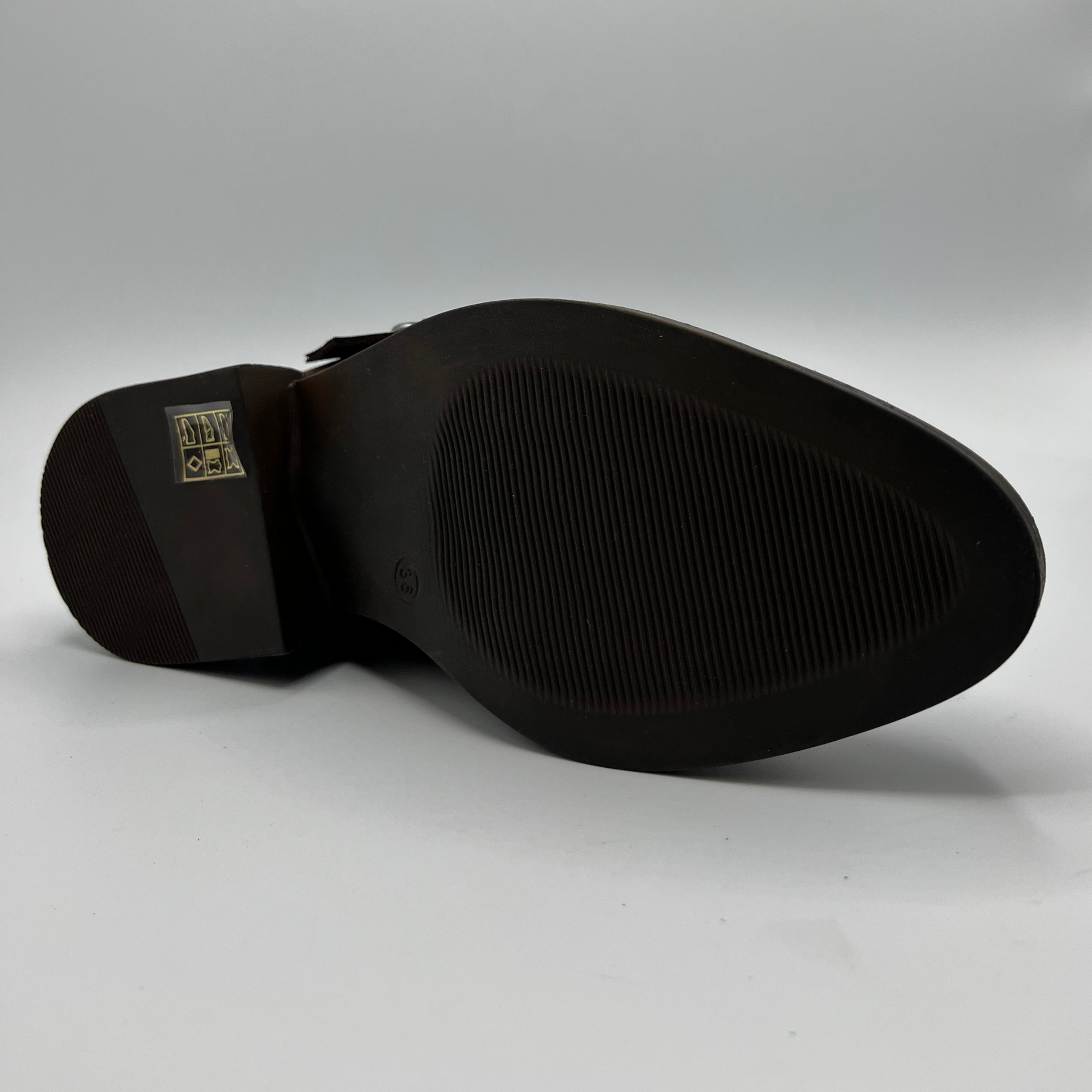 Black shoe sole on a gray background