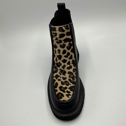 Black Chelsea boot with a leopard print accent on a white background