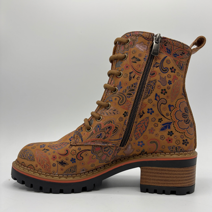 Left facing view of a tan boot with a floral motif, stacked heel and matching laces