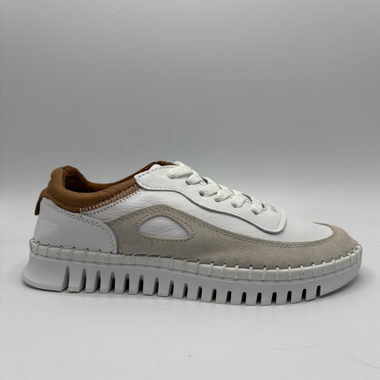 White and brown sneaker on a gray background