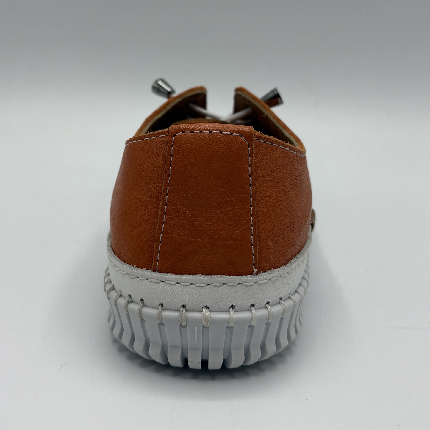 Back view of an orange lace up sneaker