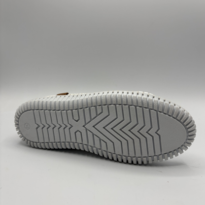 Bottom view of an orange lace up sneaker