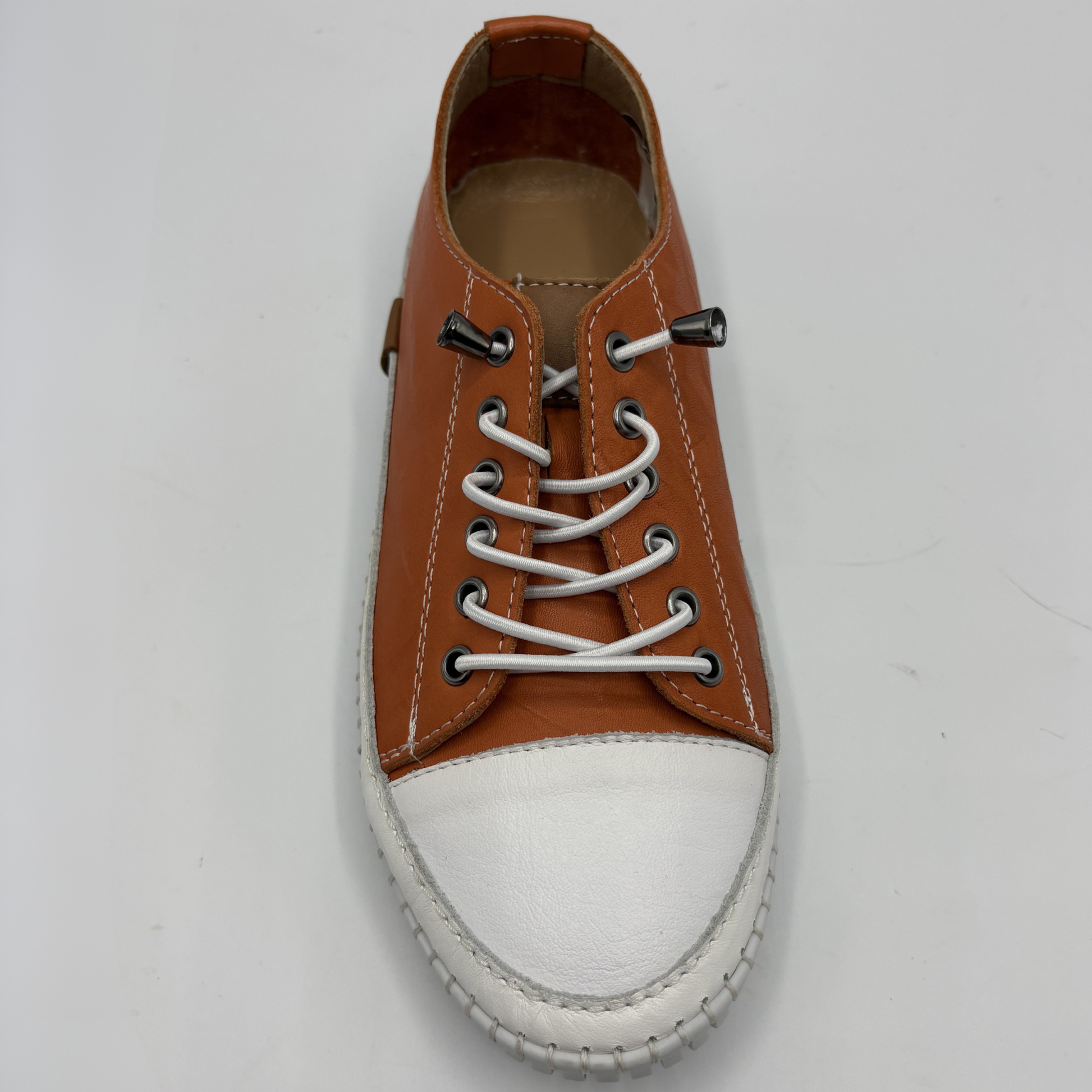 Top view of an orange lace up sneaker