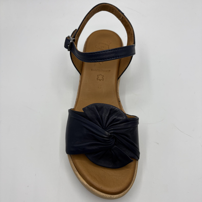 Dark navy sandal with a knot on a white background