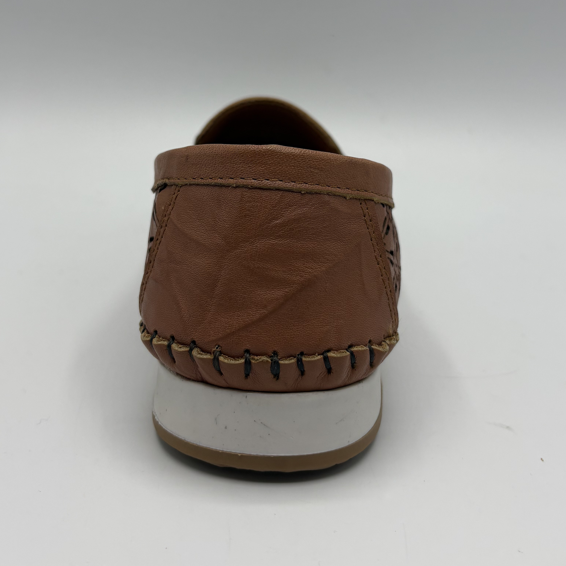 Back view of a brown leather slip on shoe