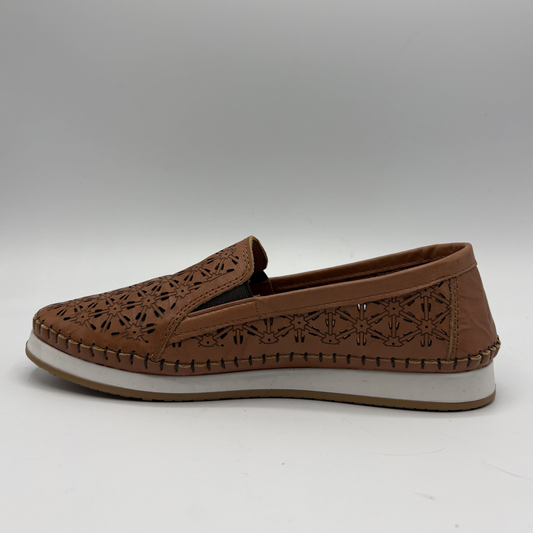 Left facing view of a brown leather slip on shoe with a white outsole