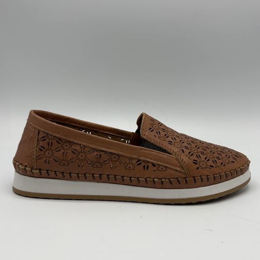 Right facing view of a brown leather slip on shoe with a white outsole