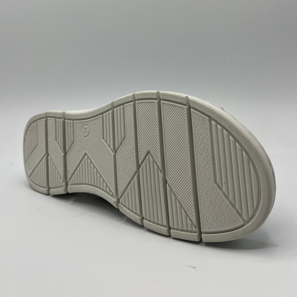Bottom view of a slip on shoe with elasticated side bands, peep toe and a white rubber outsole.