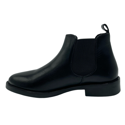 Left facing view of short black chelsea boot with elastic side gore and black outsole