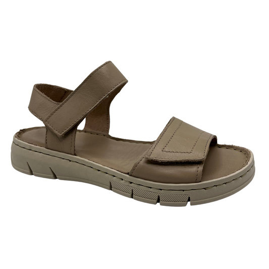 45 degree angled view of taupe leather sandal with rubber outsole and adjustable velcro straps