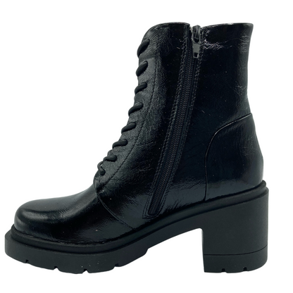 Left facing view of black patent leather boot with side zipper closure and chunky black heel