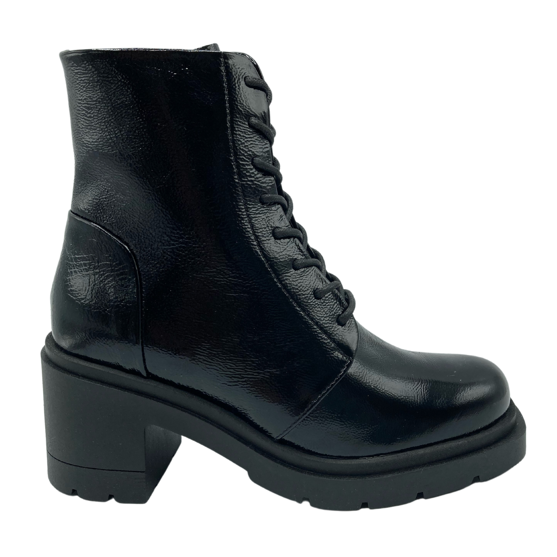 Right facing view of black patent leather boot with chunky rubber heel and matching laces