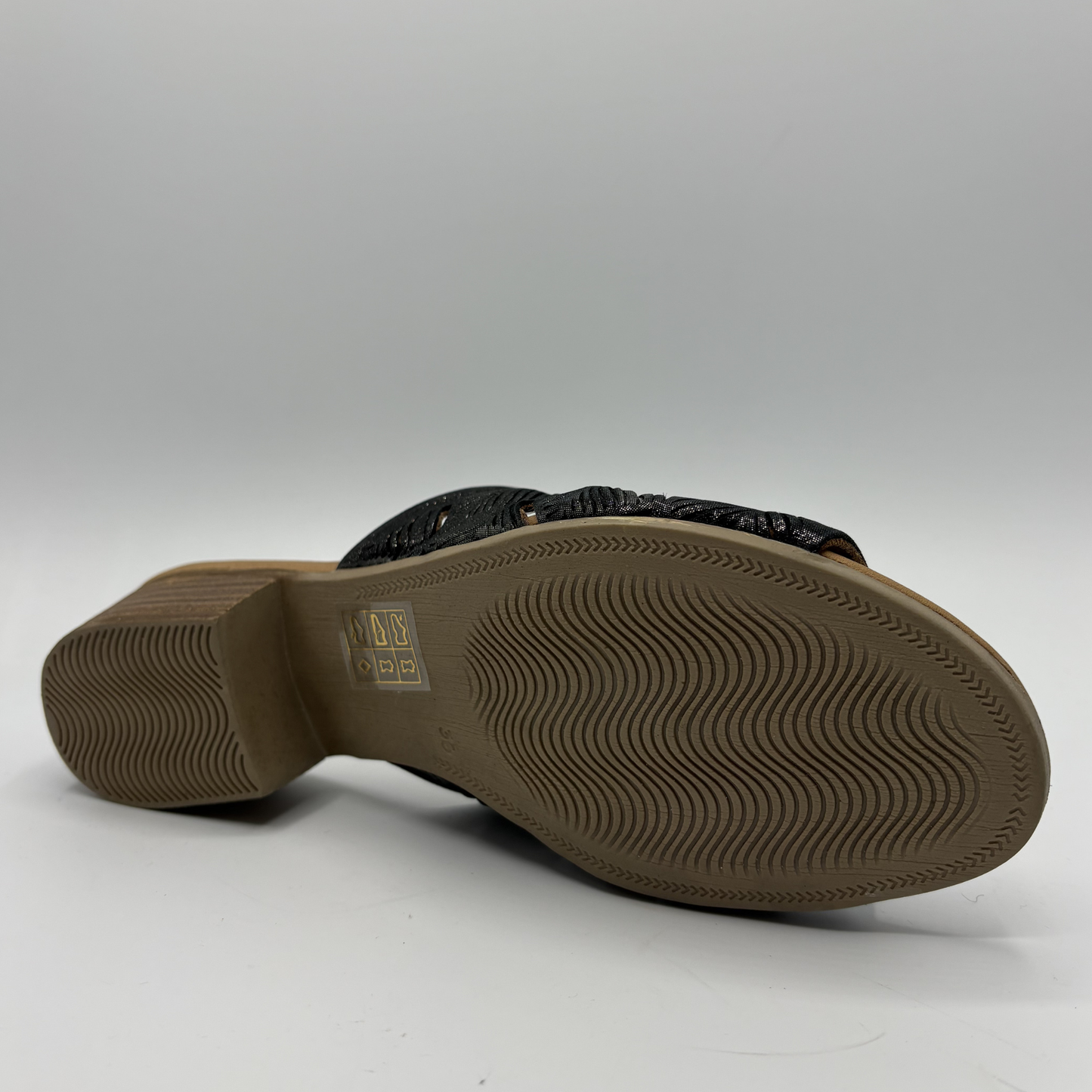 Brown sandal sole with brand logo on a white background