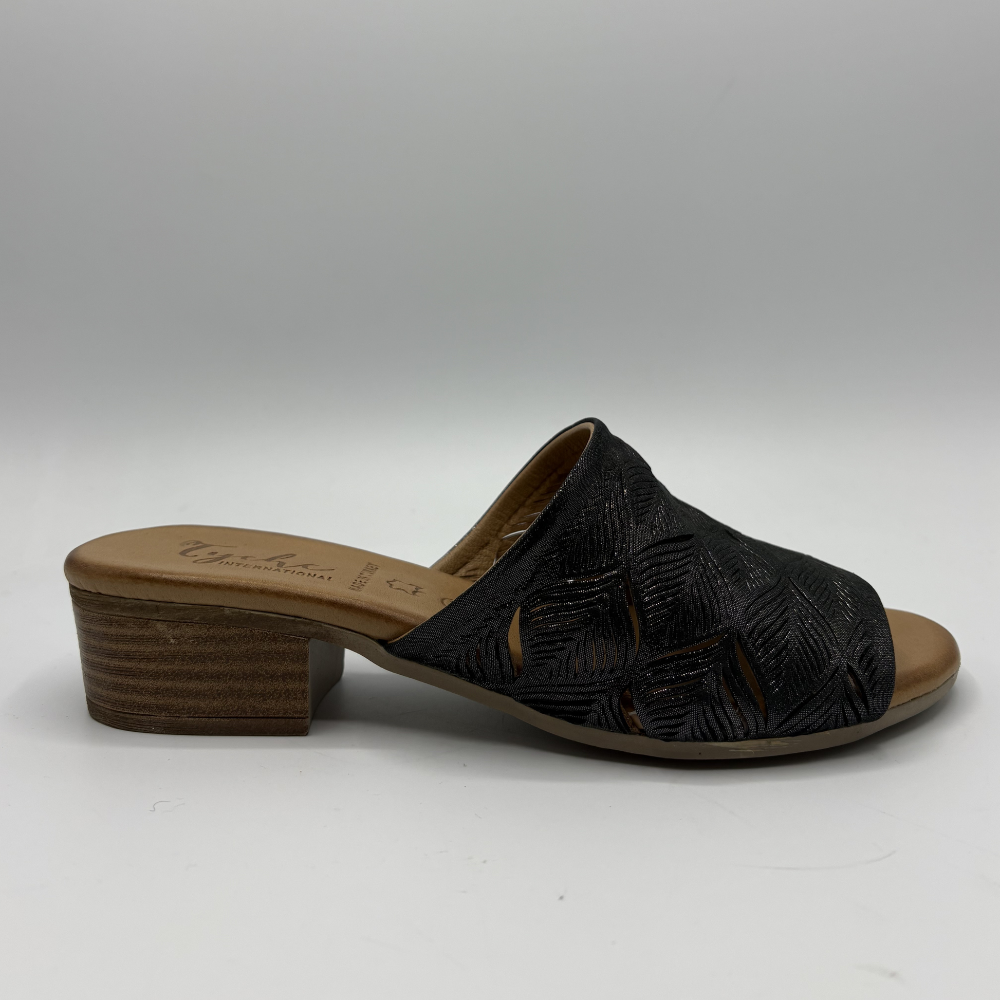 Black sandal with wooden sole on a white background