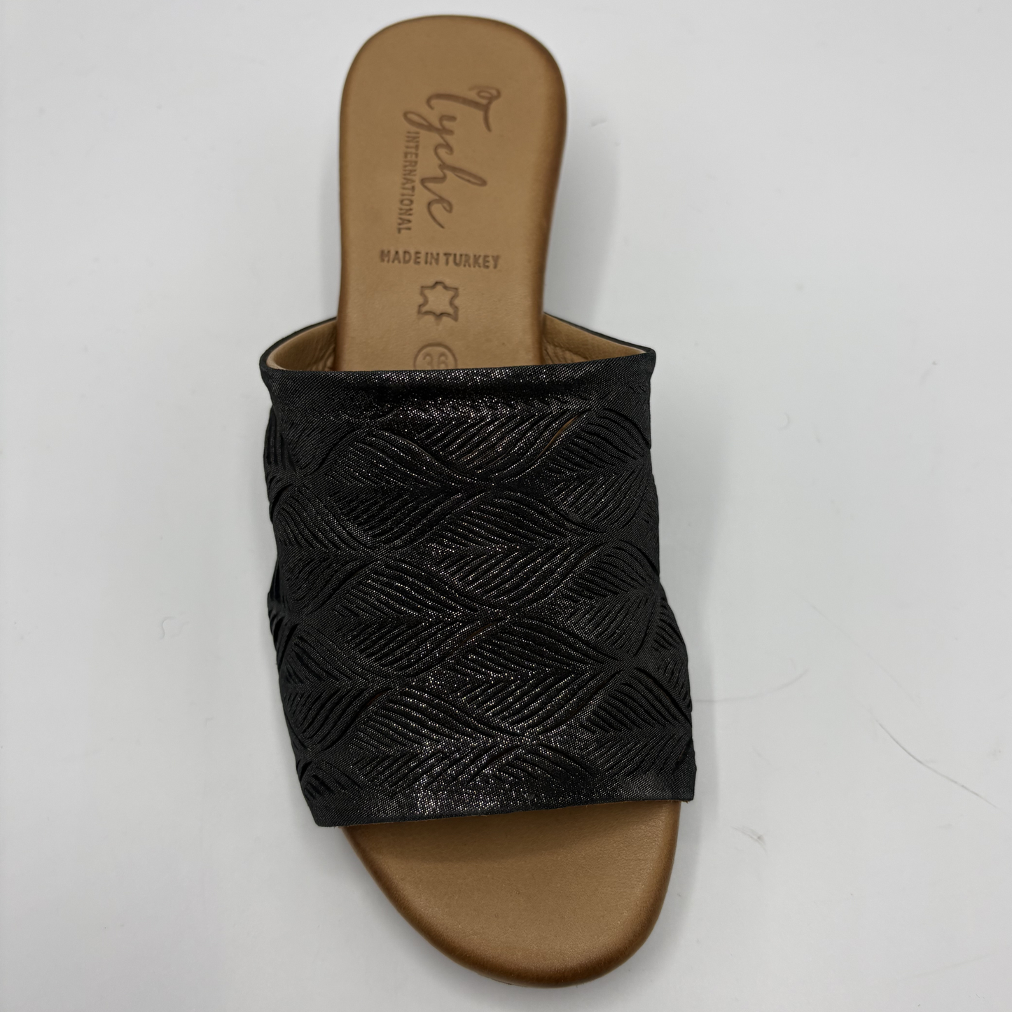 Black woven sandal with a tan sole on a white background