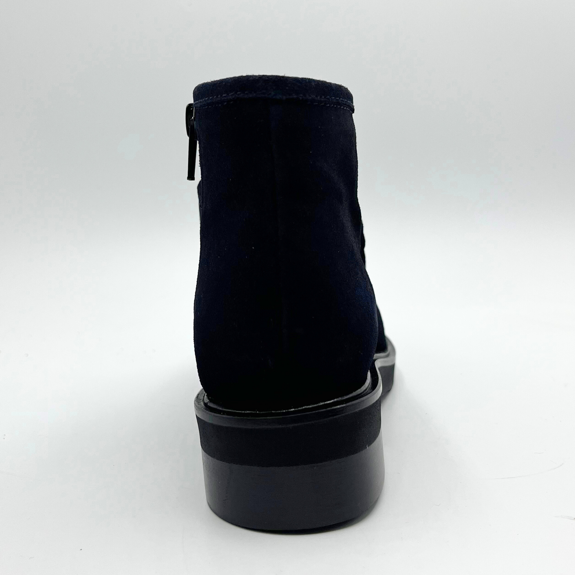 Navy ankle boot on a white background