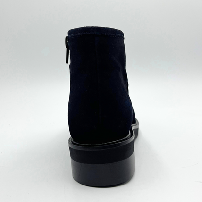 Navy ankle boot on a white background
