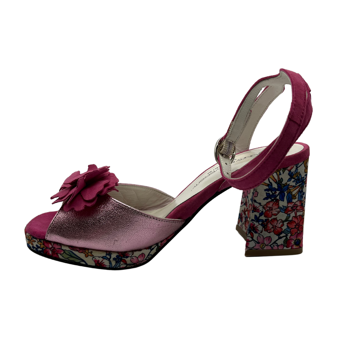 Left facing view of leather and satin material sandal with block heel and platform sole. Flower accent on toe and adjustable ankle strap