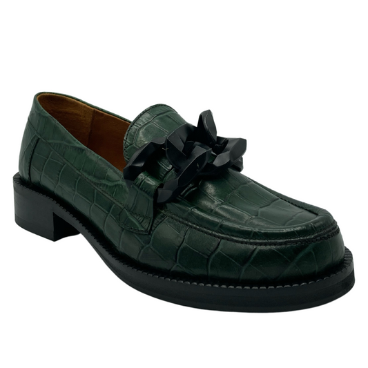 45 degree angled view of textured leather loafer with chunky black chain detail on upper and short block heel