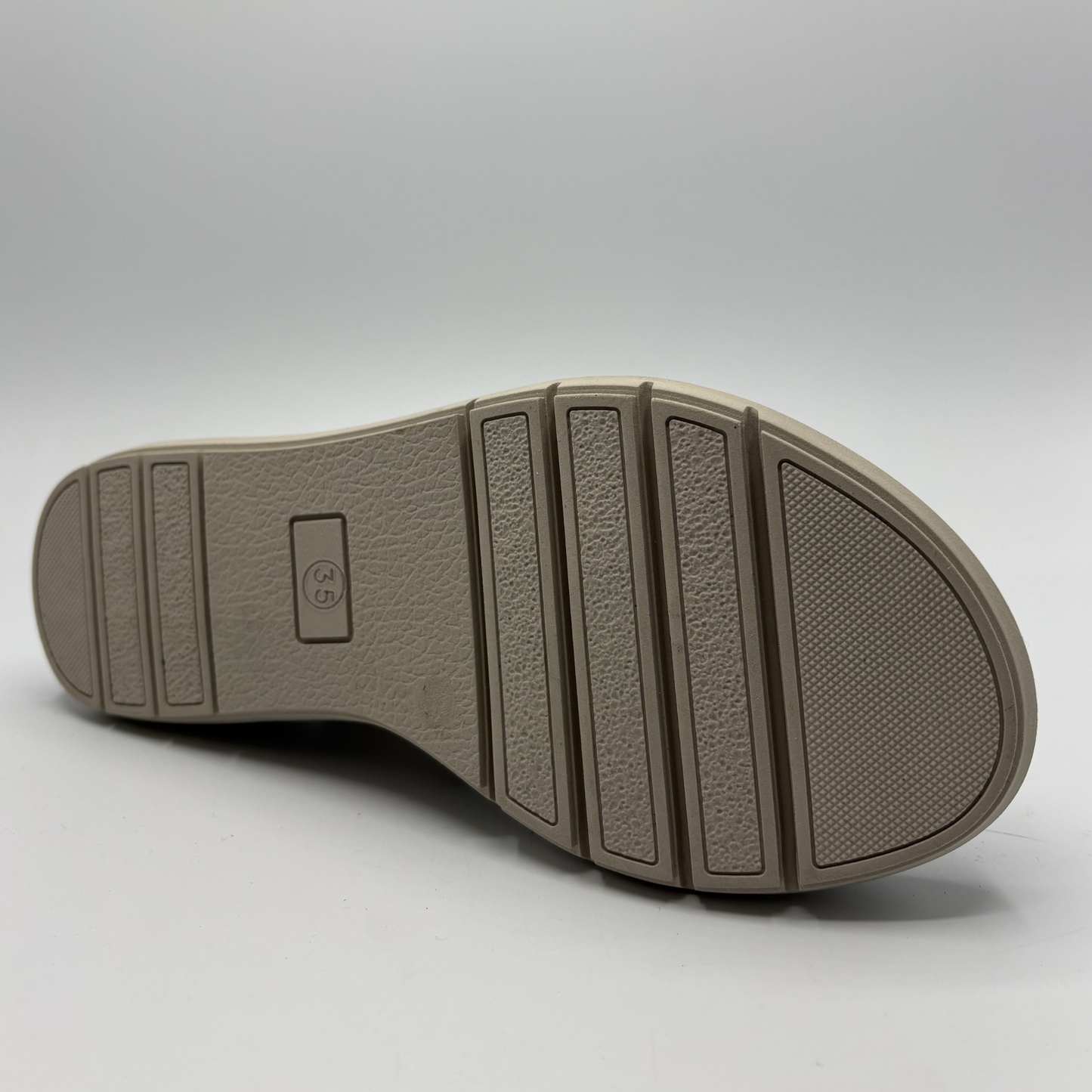 Close-up of a shoe sole on a light gray background