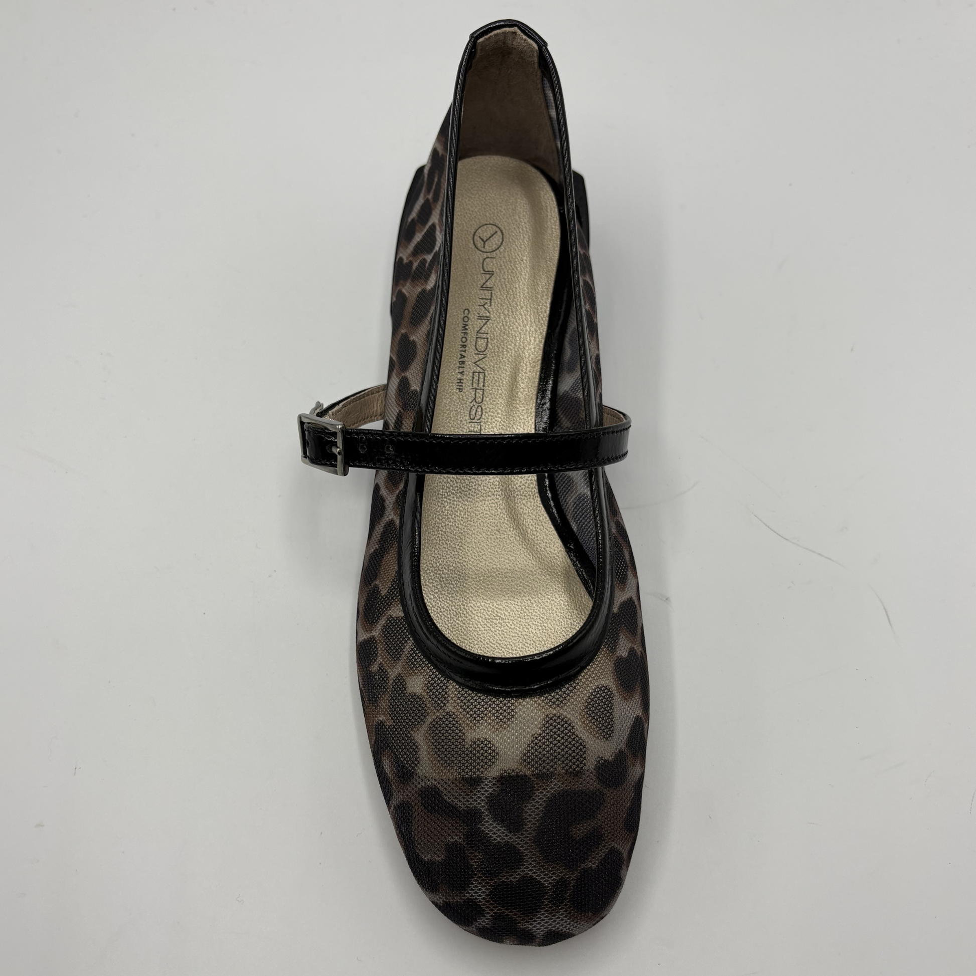 Leopard print shoe with a black strap on a white background