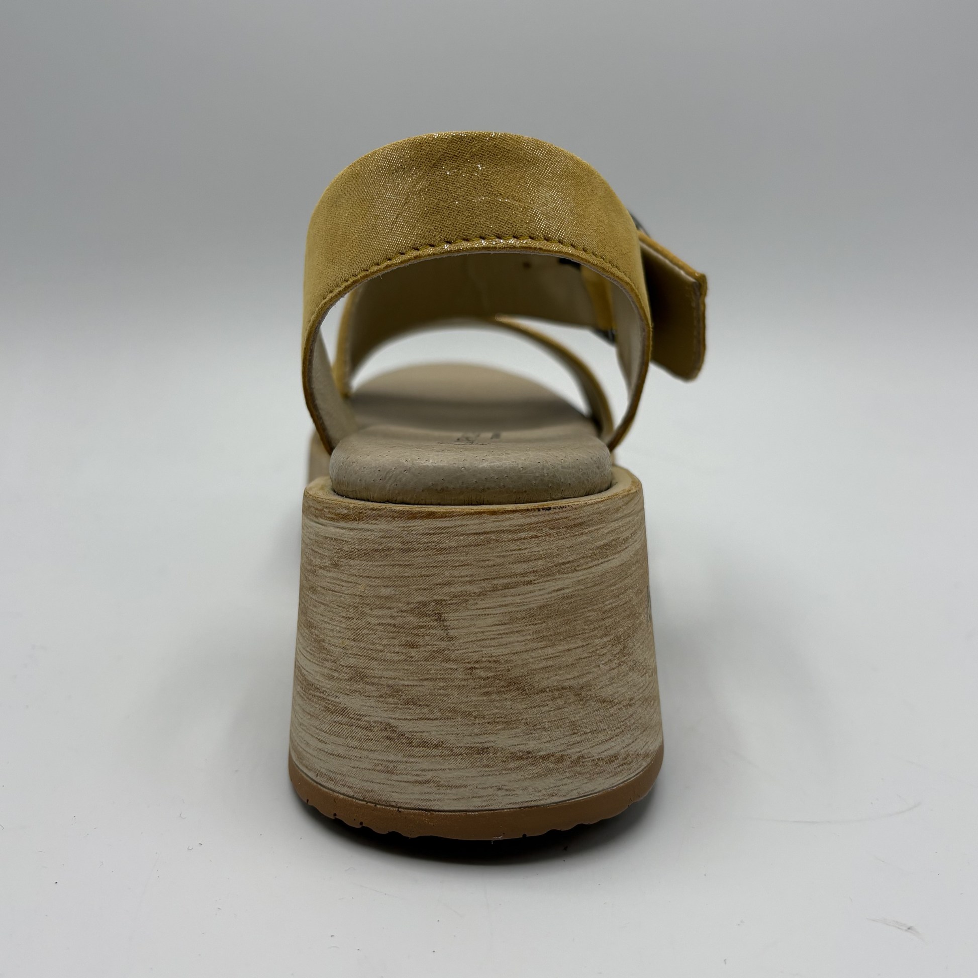 Yellow sandal with a thick sole on a white background