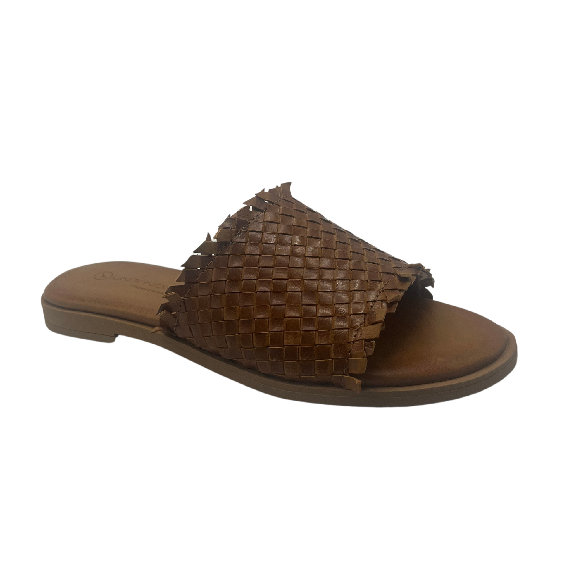 Angled view of brown woven leather slip on sandal with brown footbed