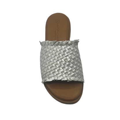 Top down view of silver woven leather slip on sandals with lined footbed and low heel