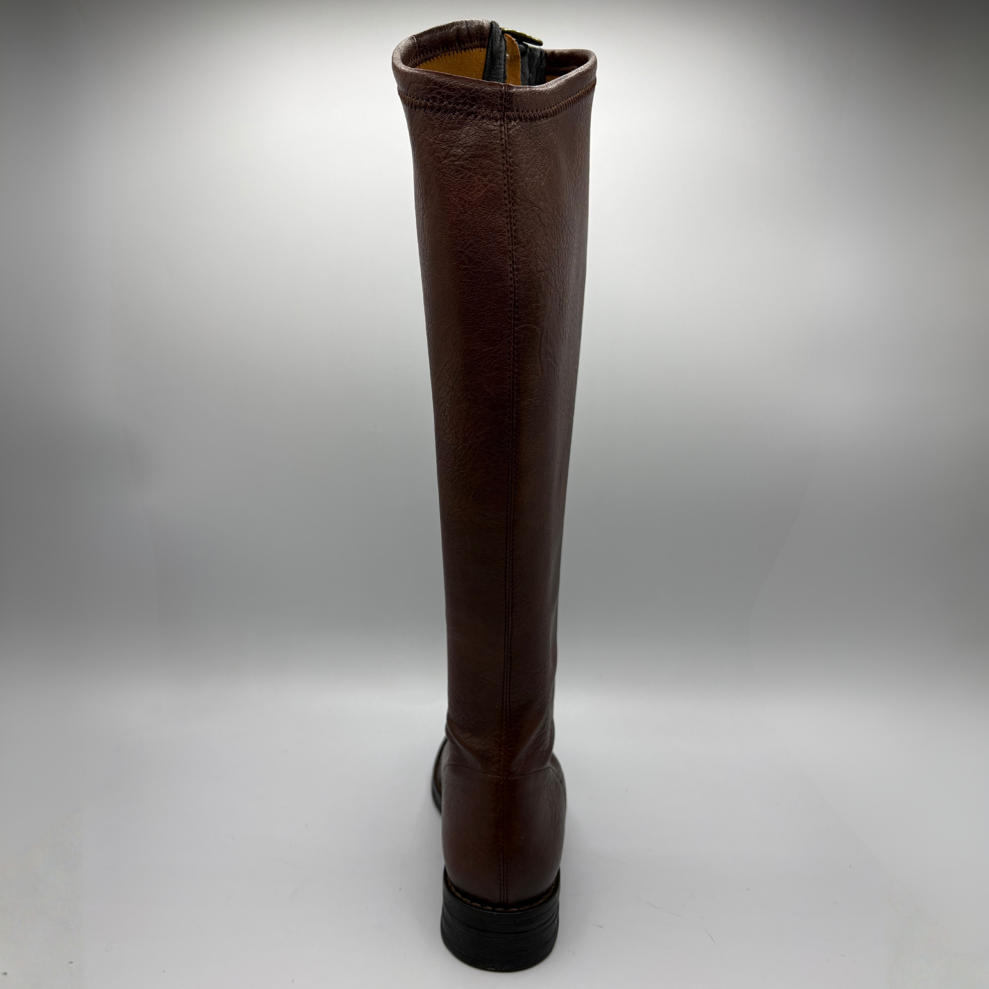 A single knee-high brown leather boot with a dark brown crocodile textured toe cap and a black sole, shown from the back  against a light gray background.
