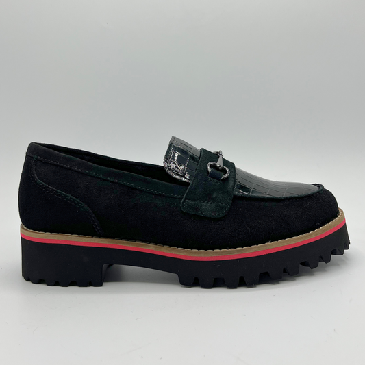 Black loafer shoe with a red sole on a light gray background