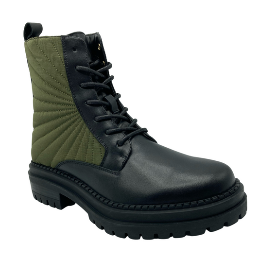 45 degree angled view of black leather and army green textile combat boot with black rubber outsole and heel