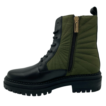 Left facing view of black leather and textile short boot with side zipper closure and black rubber outsole