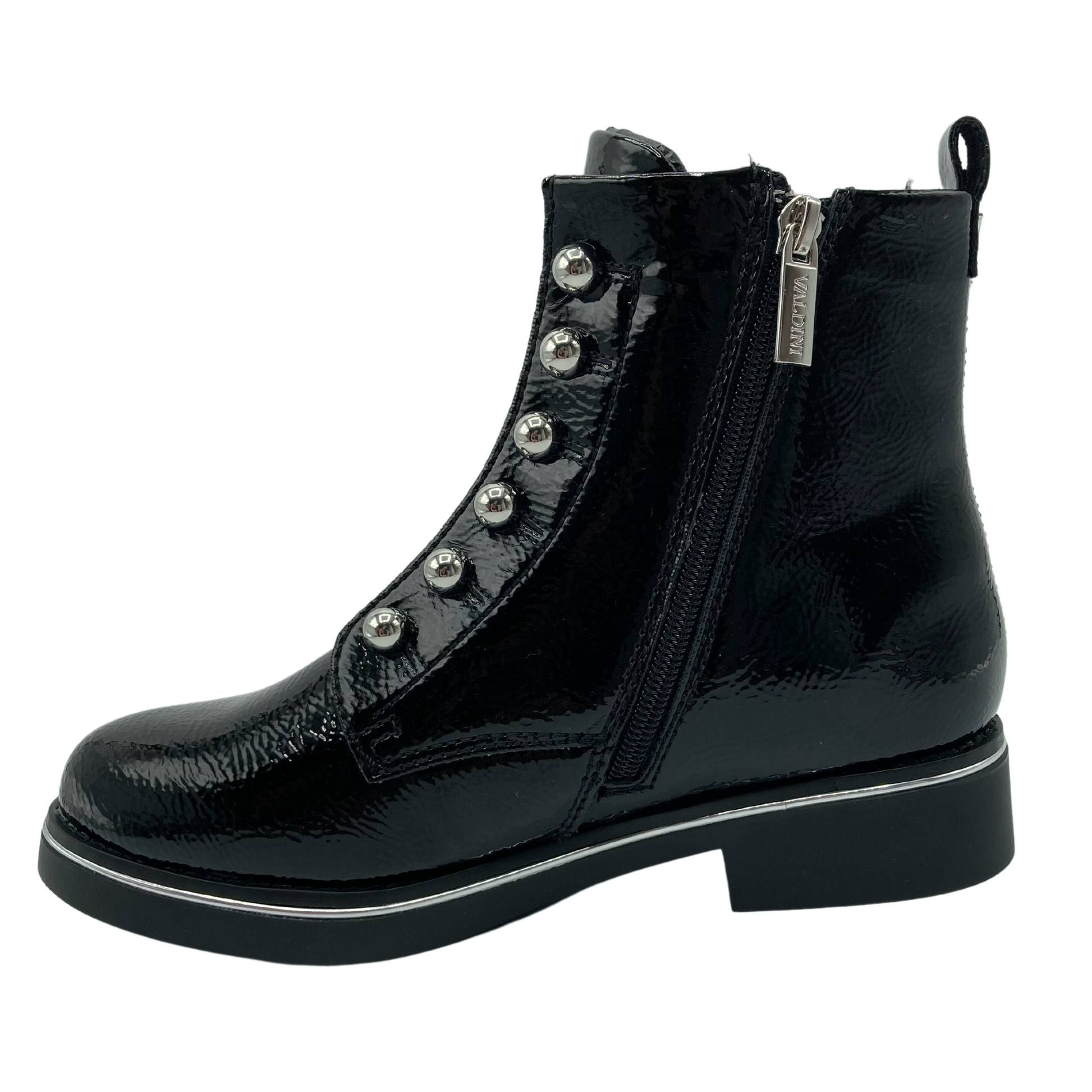 Left facing view of black patent short boot with side zipper closure, short block heel and pearl detail