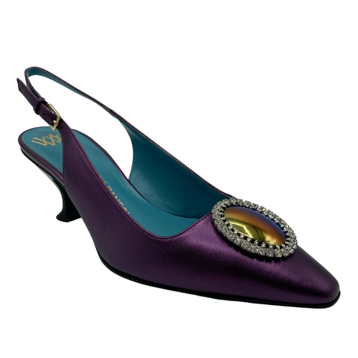 45 degree angled view of purple pointed toe, sling back pump with oval jewel detail on upper.
