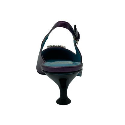 Heel view of sling back pump with flared kitten heel and teal coloured lining