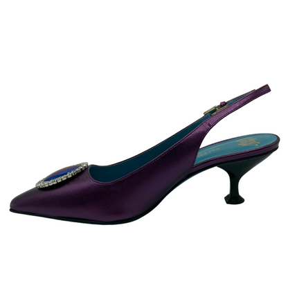 Left facing view of purple sling back pump with flared kitten heel and pointed toe