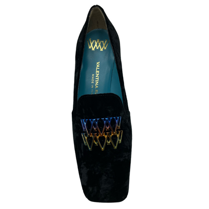 Top view of black suede square toed loafer with blue insole and multicoloured detail on upper