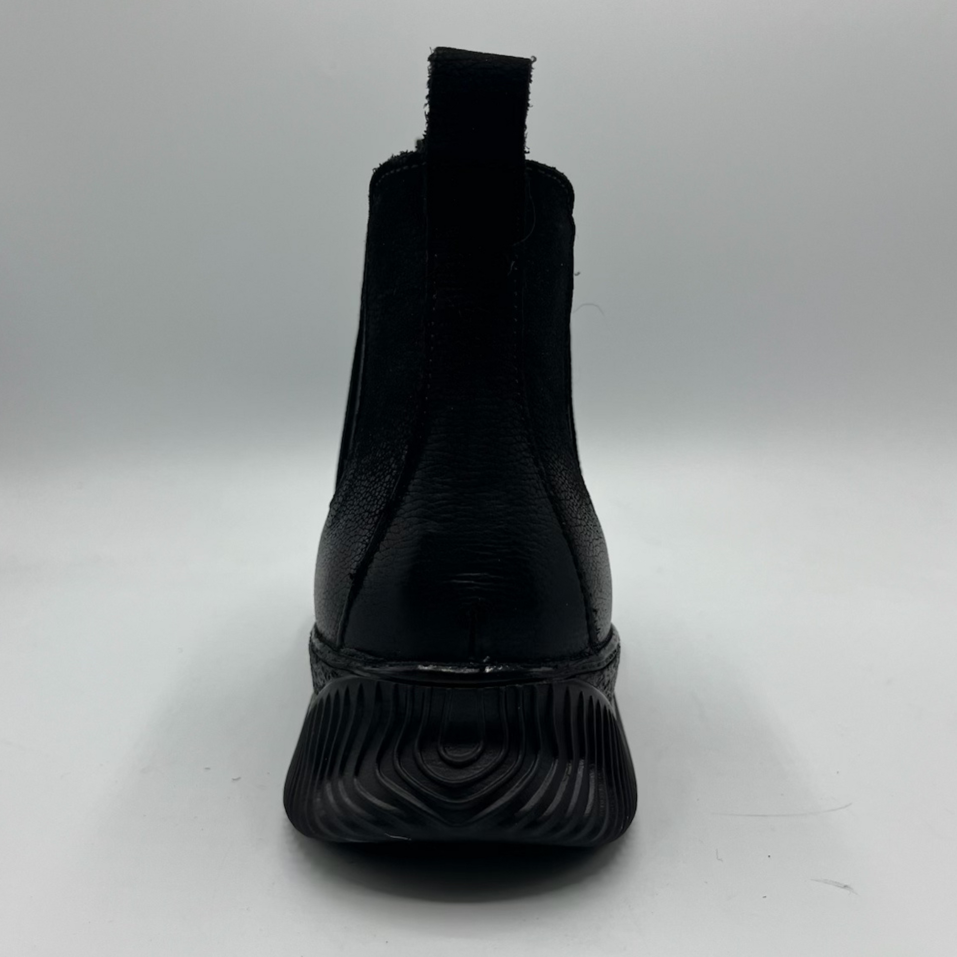 Black ankle boot on a white background